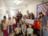 First place winners were Sharon Doelger’s K-5 art classes at Harmony Elementary School.  Their door is called "Freedom to Create." The class is pictured here with MTHS trustee Tara Berson and Mayor Tony Perry to present the check.