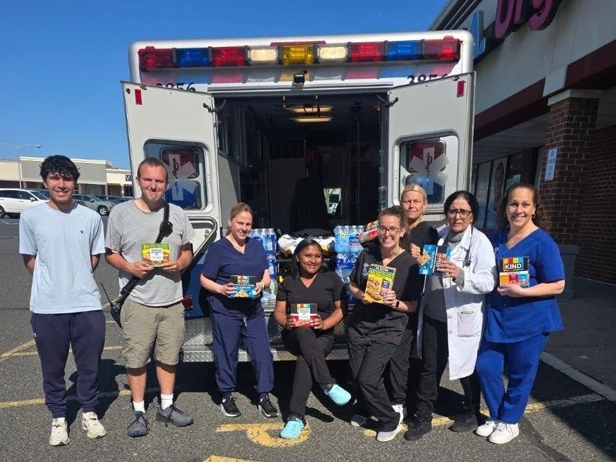 Oceanport First Aid picks up bottled water donations from IMA Urgent Care Shrewsbury.