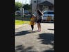 A Secaucus kid gets help carrying the torch.