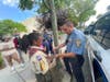 He showed the boys how handcuffs work.