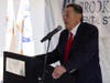 Dr. Robert Cheslock, founder and board member of Parker Family Health Center, speaks at the opening of the dental clinic.