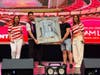 The winner of the signed Lionel Messi jersey with American Dream owner Roy Ghermezian, on the left side of the jersey, Wednesday night inside the mall.