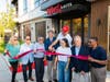 July 30 ribbon cutting: Long Branch Mayor John Pallone, center, with Inkwell Lofts owner and Somerset Development CEO Ralph Zucker immediately to his left.