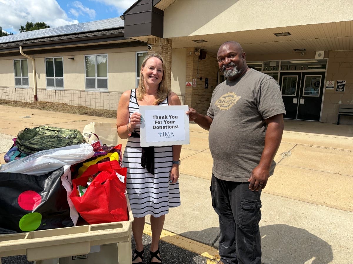 Meadowbrook School’s Principal Tiffany Boufford and custodian, Mr. James with supplies.