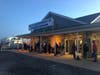 Customers wait before dawn at the Belford ferry terminal Tuesday.