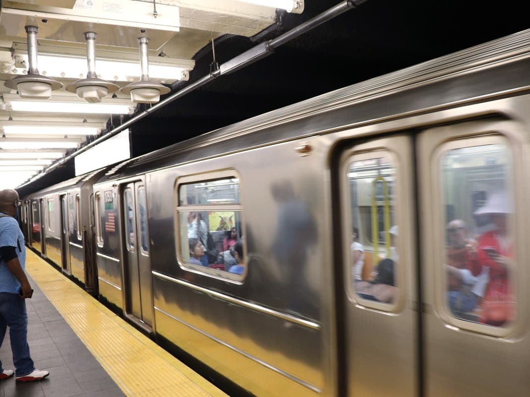 A New York City subway train enters the station.