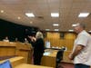 Secaucus resident Kathy Weber is one of the town's most outspoken critics of data centers, but there are many who agree with her. She speaks while town building inspector Carl Leppin is behind her.