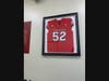 LeGrand's Rutgers jersey hangs on the wall.