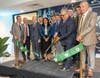 Kellie (Mitra) Doucette, chief operating officer for Gov. Mikie Sherrill, center, Johnson & Johnson CEO Joaquin Duato and others as New Brunswick DEVCO CEO Chris Paladino cuts the ribbon Tuesday.
