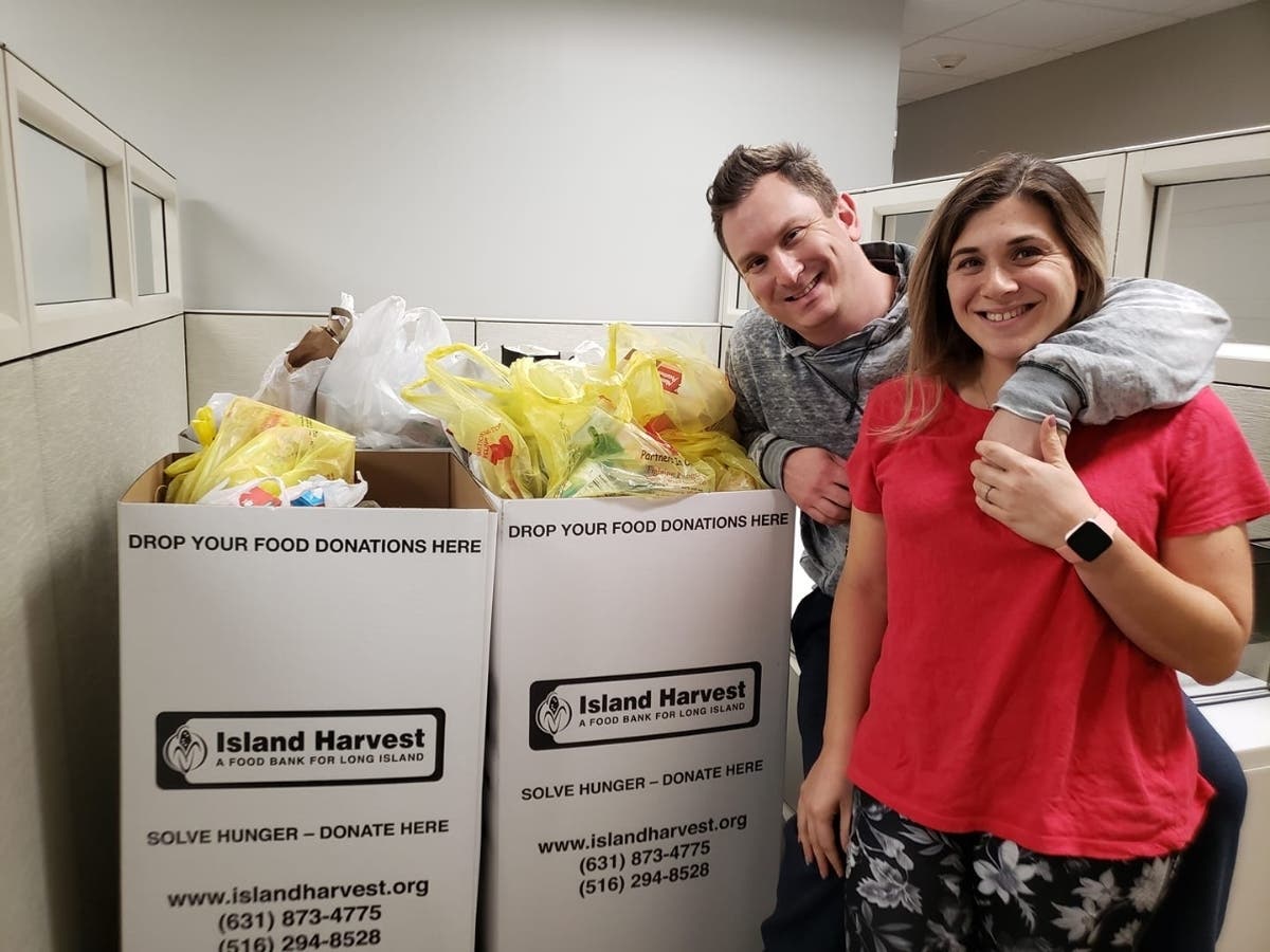 Adam and Lara Holtzer, founders of Connections4Hire with some of the food collected at a recent Sponsor-A-Family networking event,
