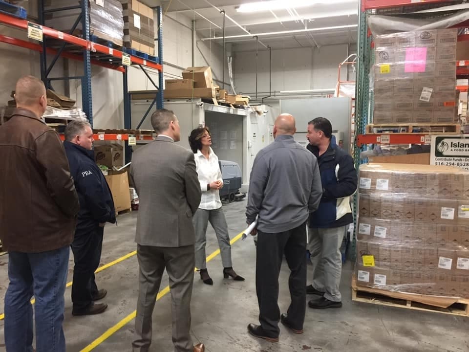 Representatives from Nassau and Suffolk's police unions tour Island Harvest Food Bank in Hauppauge