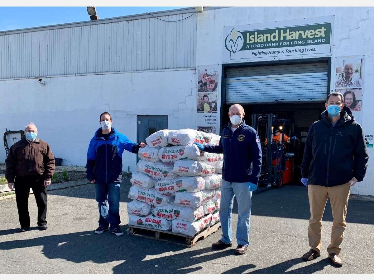 Marc Suntup, VP Development, Island Harvest Food Bank; Marc Turner, Director of Sales, Bushwick Potato Commission; New York State Assemblyman Steve Stern; and Ken Gray, VP, Sales and Marketing, Bushwick Potato Commission. 