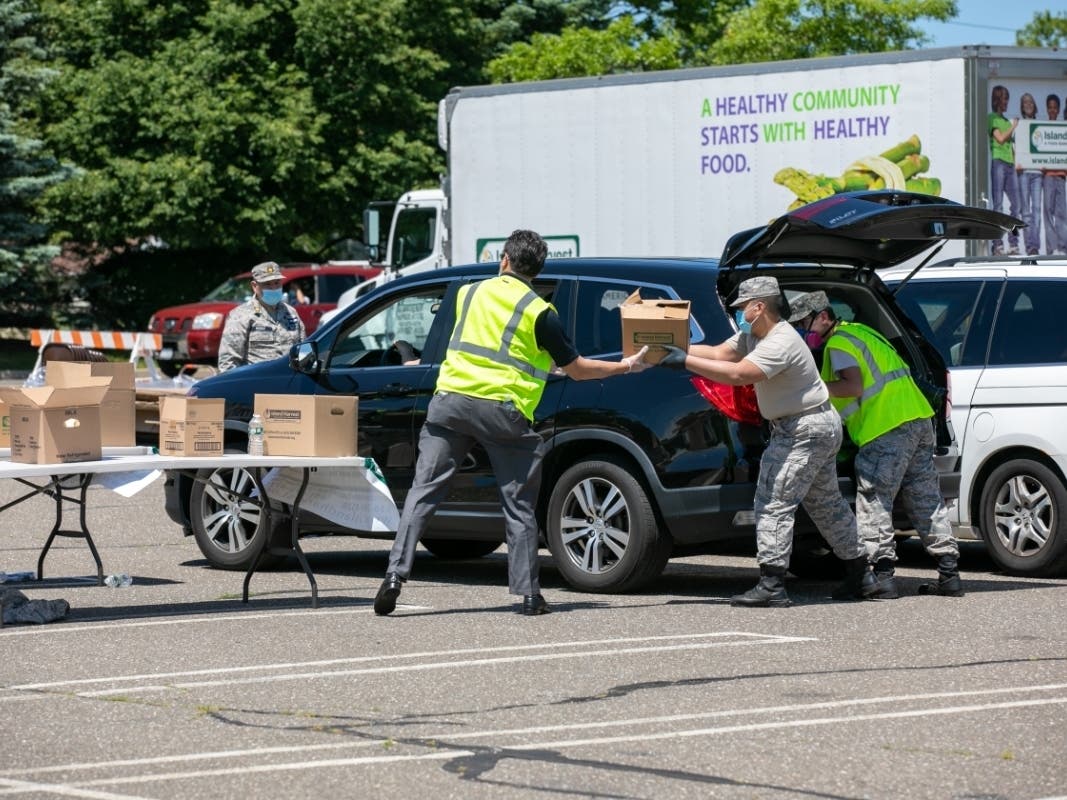 Volunteers from the Civil Air Patrol. Long Island Group, were among those on hand to assist Island Harvest Food Bank in giving out more than 100,000 pounds of food to people struggling with hunger. 