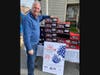 General Needs co-founder Lonnie Sherman with boots destined to help homeless veterans