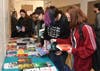 Students pick out their next favorite young adult novel at the 2019 LitCon (book courtesy of AACPL)