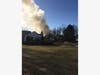 Firefighters battled a house fire Thursday morning in Warren.