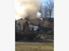 Firefighters battled a house fire Thursday morning in Warren.