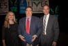 Jes Bruno and David M. Carcieri present Greg Toombs with the Living our Cause Award.