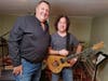 David Schneck and Alan Grant with the guitar carved from the 619-year-old Basking Ridge Oak tree.