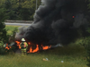 An East Brunswick woman is lucky to be alive after her car went off the highway, overturned and burst into flames Monday.
