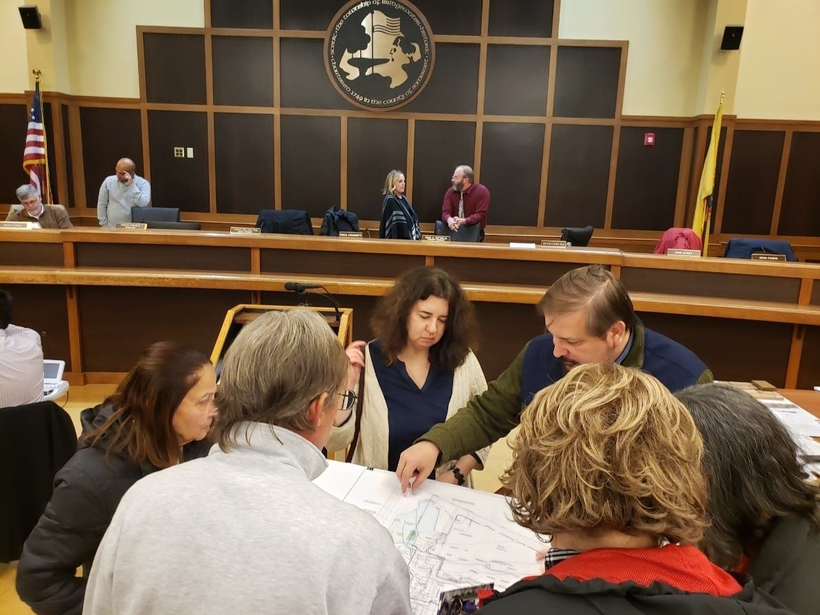 Bridgewater residents examine a map showing the area where Benzene has been detected.