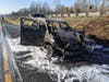 The Far Hills-Bedminster Fire Department doused the car and grassy median with foam and water to extinguish the blaze Sunday in Bridgewater.