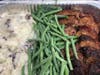 Meatloaf with mashed potatoes and green beans.