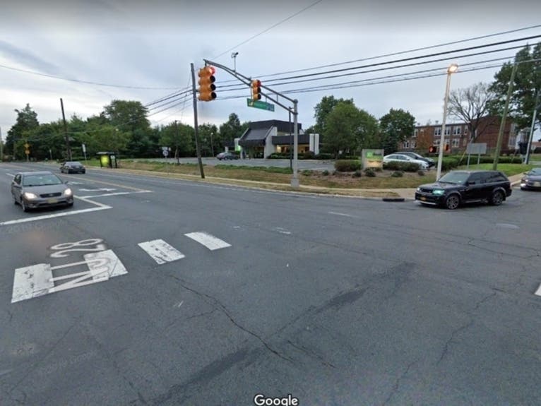 A woman walking in a marked crosswalk was killed after she was hit by a tractor trailer and then a car on Tuesday in Bridgewater, police said.
