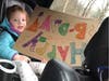 Jocelyn O'Brien's daughter Keira with a Happy Birthday sign during a recent parade.