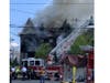 A three-alarm house fire that hospitalized two men remains under investigation by the Somerset County Prosecutor's Office.
