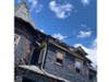 A three-alarm house fire that hospitalized two men remains under investigation by the Somerset County Prosecutor's Office.