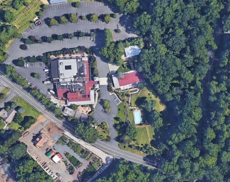 Hours before a scheduled public hearing was to take place Monday to discuss plans to build a hotel on the grounds of the Stone House Restaurant in Warren, it was rescheduled.