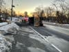 A driver was rescued by Clark firefighters after the dump truck overturned on icy roads in the township.