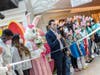 Girl Scouts accompanied the famed springtime icon down the Bridgewater Commons' escalator with song and cheer to a ribbon-cutting ceremony.