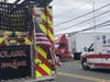 The fire department put a ladder up to the top of the cab and got the driver untangled and to the ground.