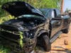 A Ram pickup truck had left the roadway, overturned, collided with a telephone pole/guardrail and stopped just short of hitting a Branchburg home.