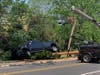 A Ram pickup truck had left the roadway, overturned, collided with a telephone pole/guardrail and stopped just short of hitting a Branchburg home.