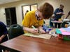 Cub Scout Pack 55 make breakfast bags for local kids in need.