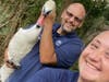 Animal Control Officer Jesse Ostrowski​ and Shelter Manager Brian Bradshaw with the swan.