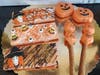 Candy bars, candy pretzels, chocolate-covered pumpkin design Oreos.