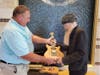 David Schneck is seen giving Steve Cropper a guitar he crafted from the tree.