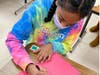 Woodland student Marley Edwards pens a special message to a veteran.