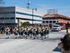 Bagpipers proceed County Hills FD's contingent of trucks.