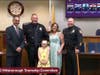 Sergeant Jack Howard with his family, Mayor Lipani and Chief Mike McMahon.