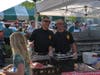 Pat Knapp and Todd Mele, giving a thumbs up,have a brief lull in serving up hamburgers and hot dogs to the crowd. 