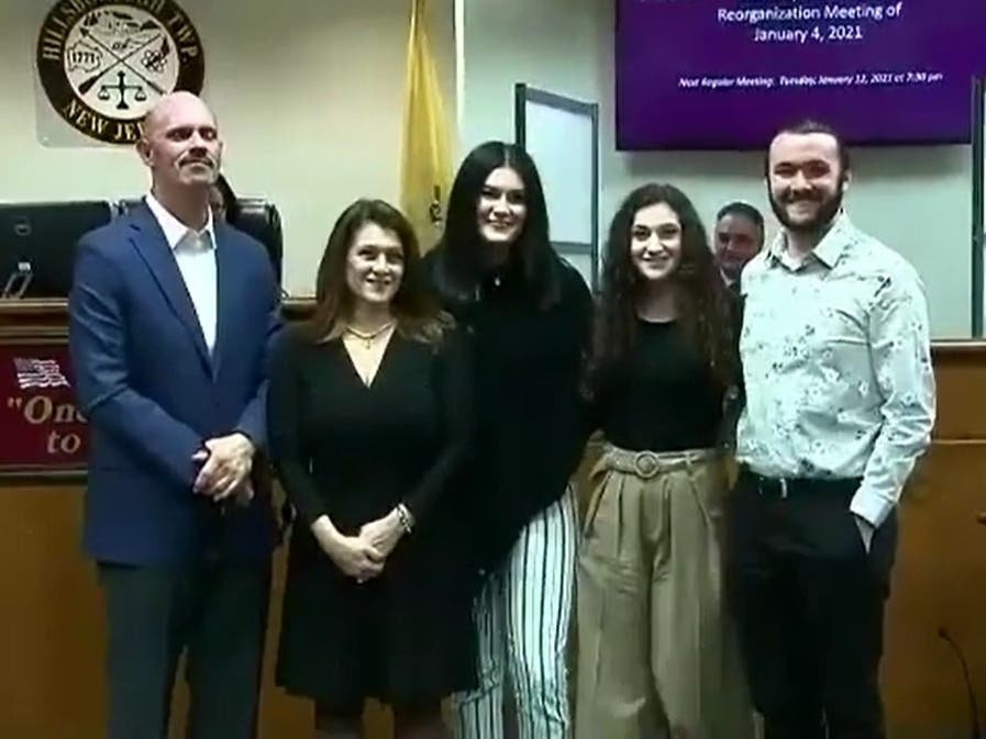 Janine Erickson and her family after being sworn in on January 2021.