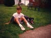 Robbie Banfitch with his dog in his stepfather's Manville backyard.