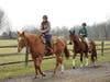 Commissioner Sara Sooy (l), who grew up riding at the Stable at Lord Stirling Park, worked hard to restore services to the Stable at Lord Stirling Park, and had a great time on her trail ride with Olympus.