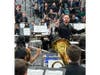 The high School band plays under Director Nick Mossa.