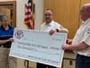 President Greg Taylor & Vice President Don Hart presenting check to Captain Sarah Bonnefoi of the Basking Ridge First Aid Squad.